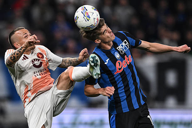 Charles De Ketelaere of Atalanta competes for the ball with Angelino of Roma